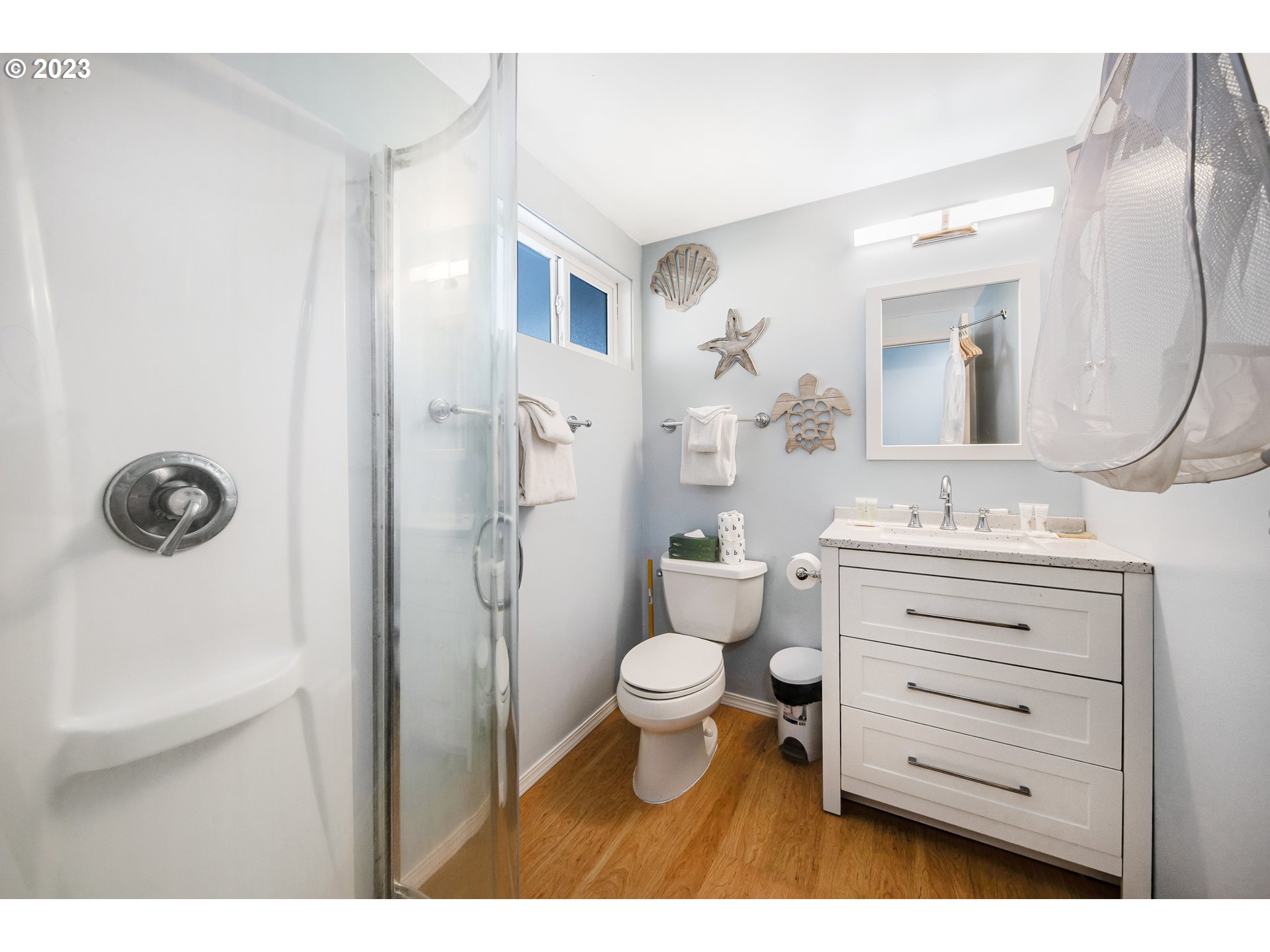 2316 Beach Drive, Unit 157 Seaside, OR 97138 - Photo 12 of 24 a bathroom with a granite countertop toilet a sink and a mirror