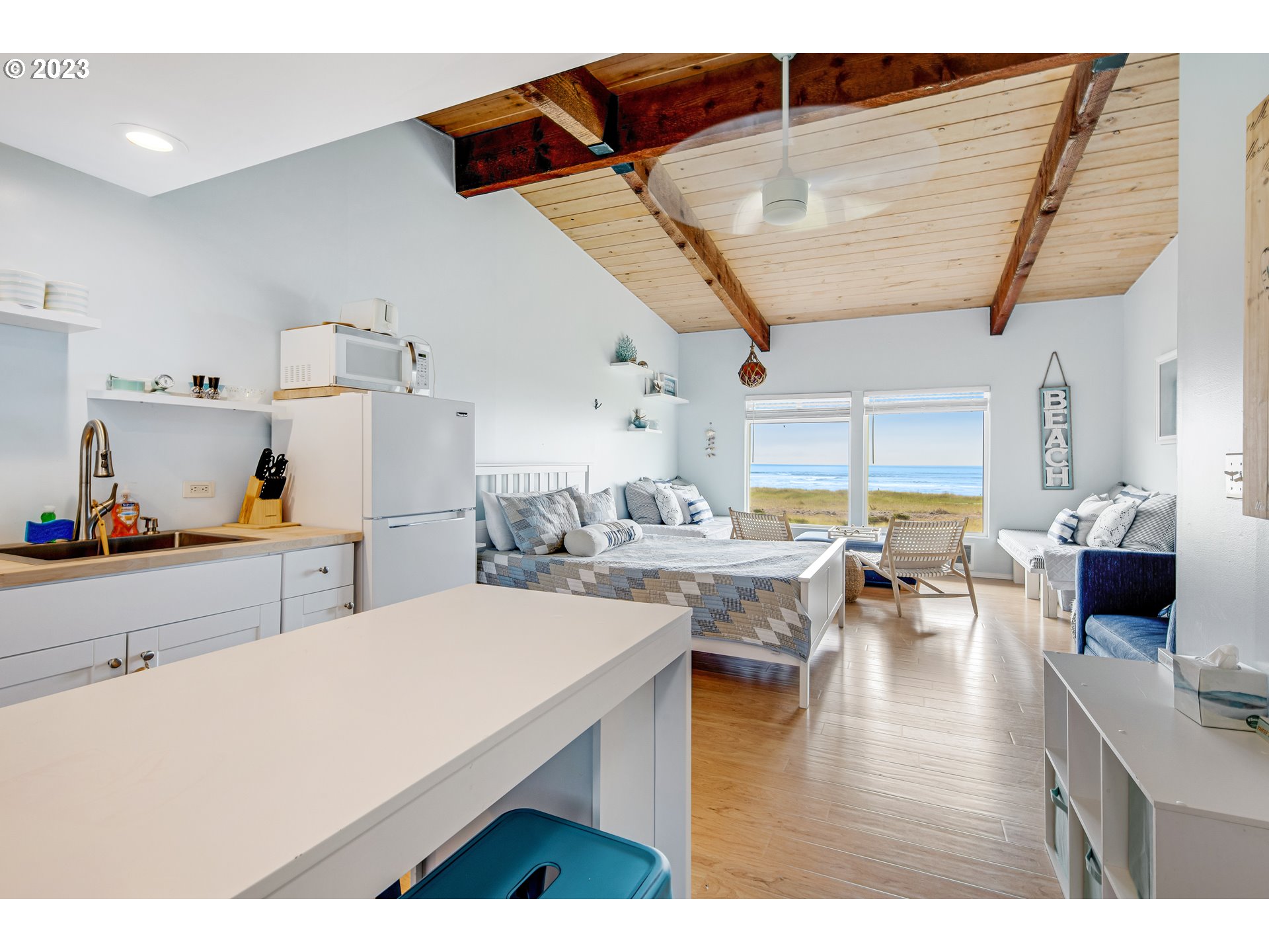 2316 Beach Drive, Unit 157 Seaside, OR 97138 - Photo 4 of 24 a kitchen with a table and chairs