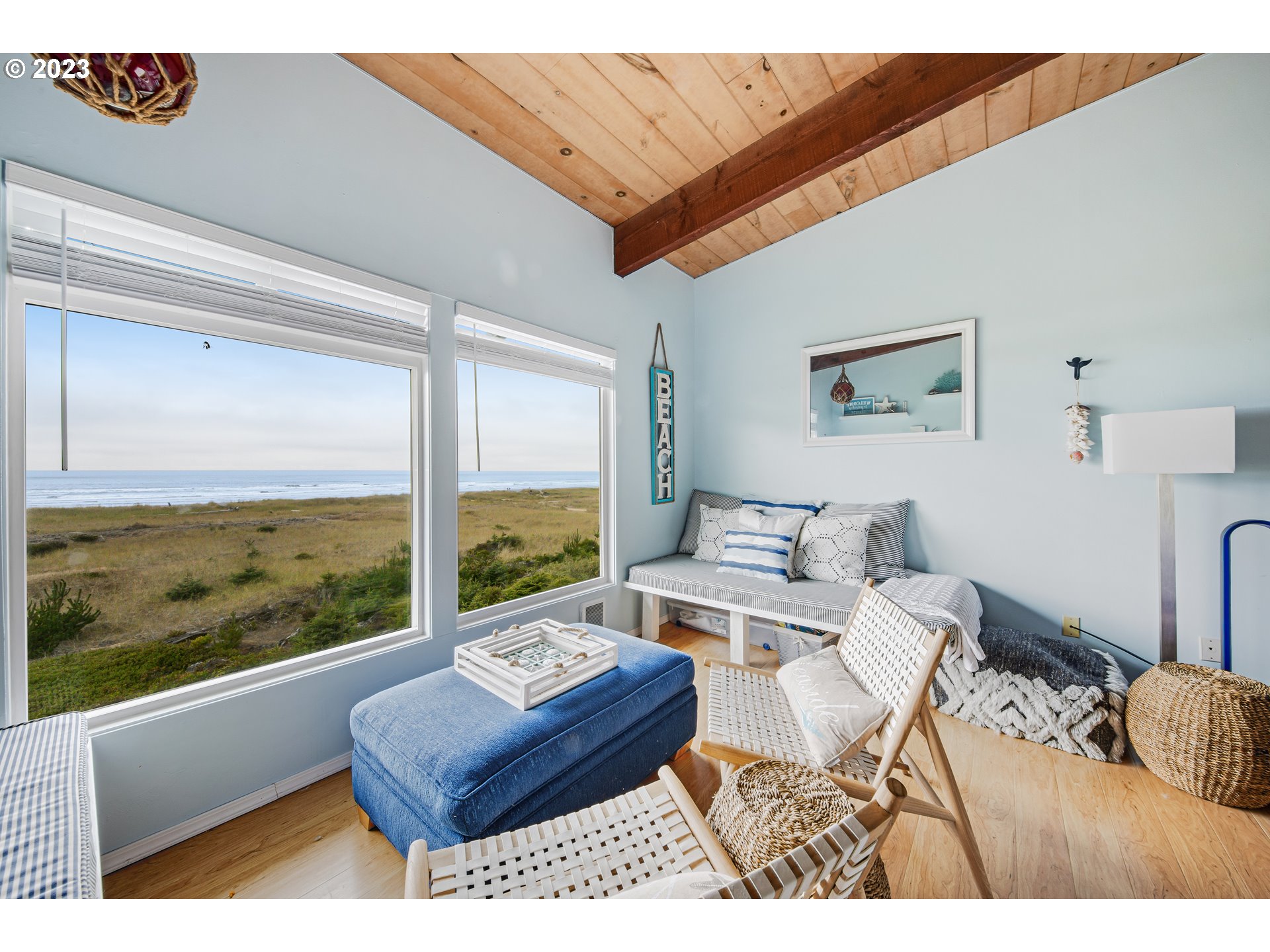 2316 Beach Drive, Unit 157 Seaside, OR 97138 - Photo 5 of 24 a living room with furniture and a floor to ceiling window