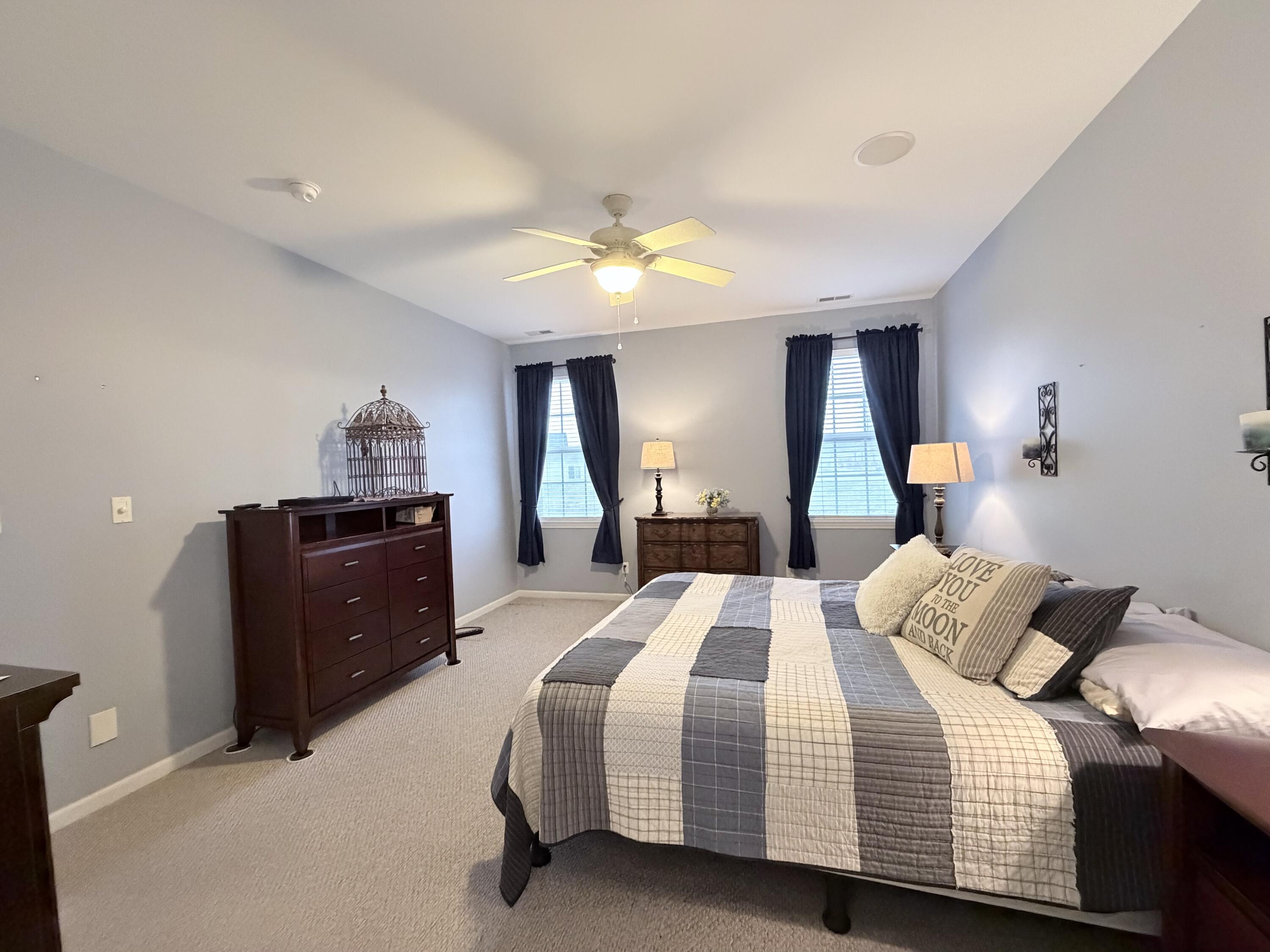 11677 Maryland Street Crown Point, IN 46307 - Photo 15 of 31 a bedroom with a bed and wooden floor
