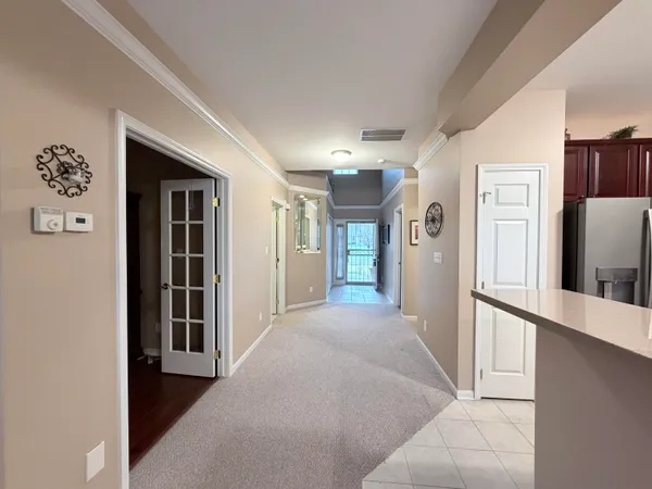 a living room with furniture and a mirror