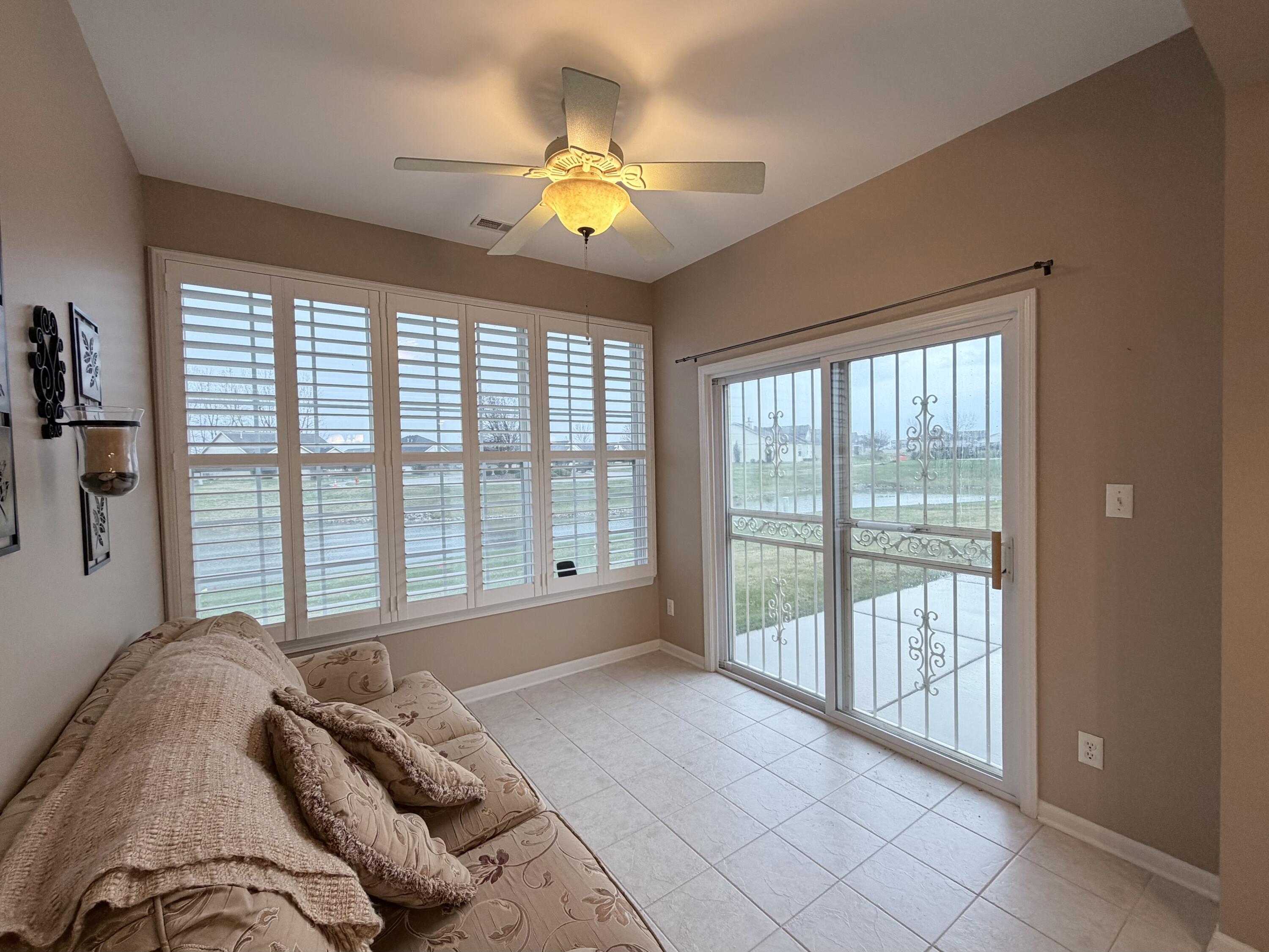11677 Maryland Street Crown Point, IN 46307 - Photo 24 of 31 a spacious bedroom with a bed and a large window