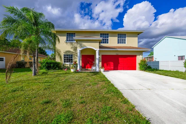 a front view of house with yard and outdoor seating