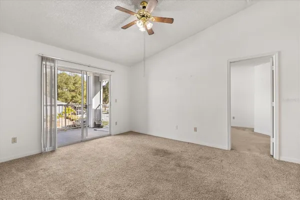 a view of an empty room with a window