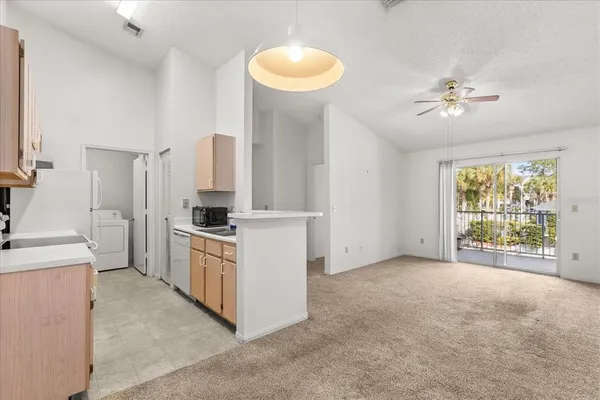a kitchen with cabinets and a stove