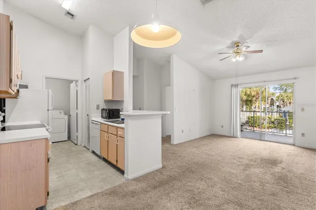 a kitchen with cabinets and a stove