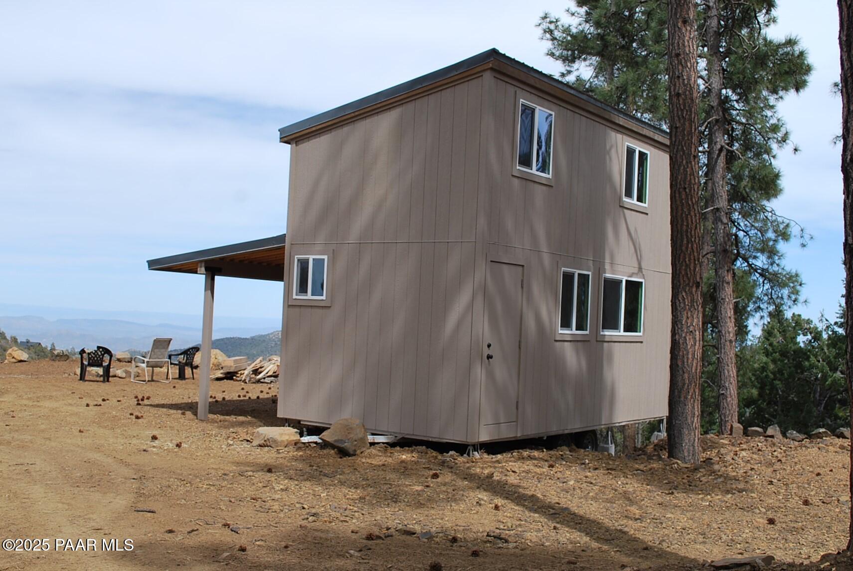 0 East Refuge Hideout Road Prescott, AZ 86303 - Photo 9 of 41 a backyard of a house with table and chairs