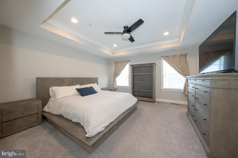 a large white bed in a white room