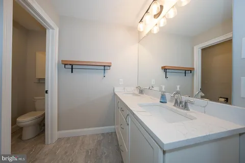 a bathroom with a shower and a toilet