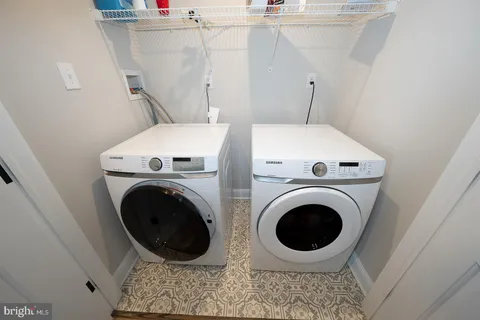 a view of a livingroom with furniture and a window