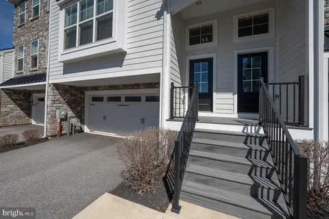 a view of a house with more windows and stairs