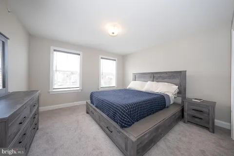 a bathroom with a toilet a sink and shower