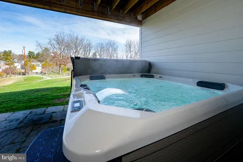 a view of a white house with a yard