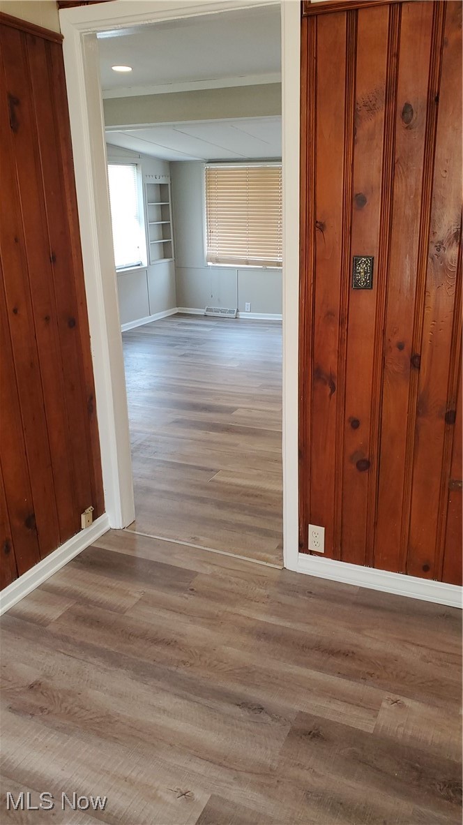 17610 Brazil Road Cleveland, OH 44119 - Photo 30 of 50 Hall featuring light hardwood / wood-style floors and built in shelves