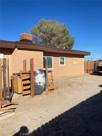 a view of a backyard of a house