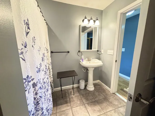 a view of a room that has a bed