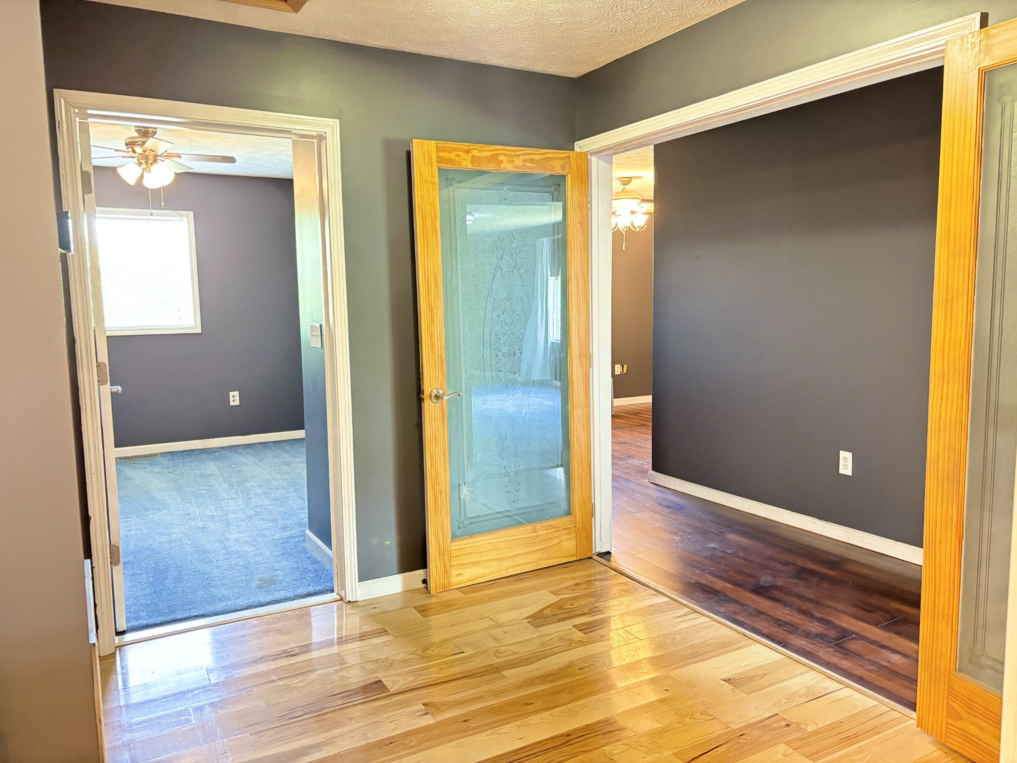 545 Adams Store Poole Mill Road Crofton, KY 42217 - Photo 13 of 48 a view of an empty room with wooden floor and a bathroom