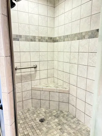 a white bath tub sitting in a bathroom