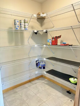 a view of a kitchen with cabinet and mirrors