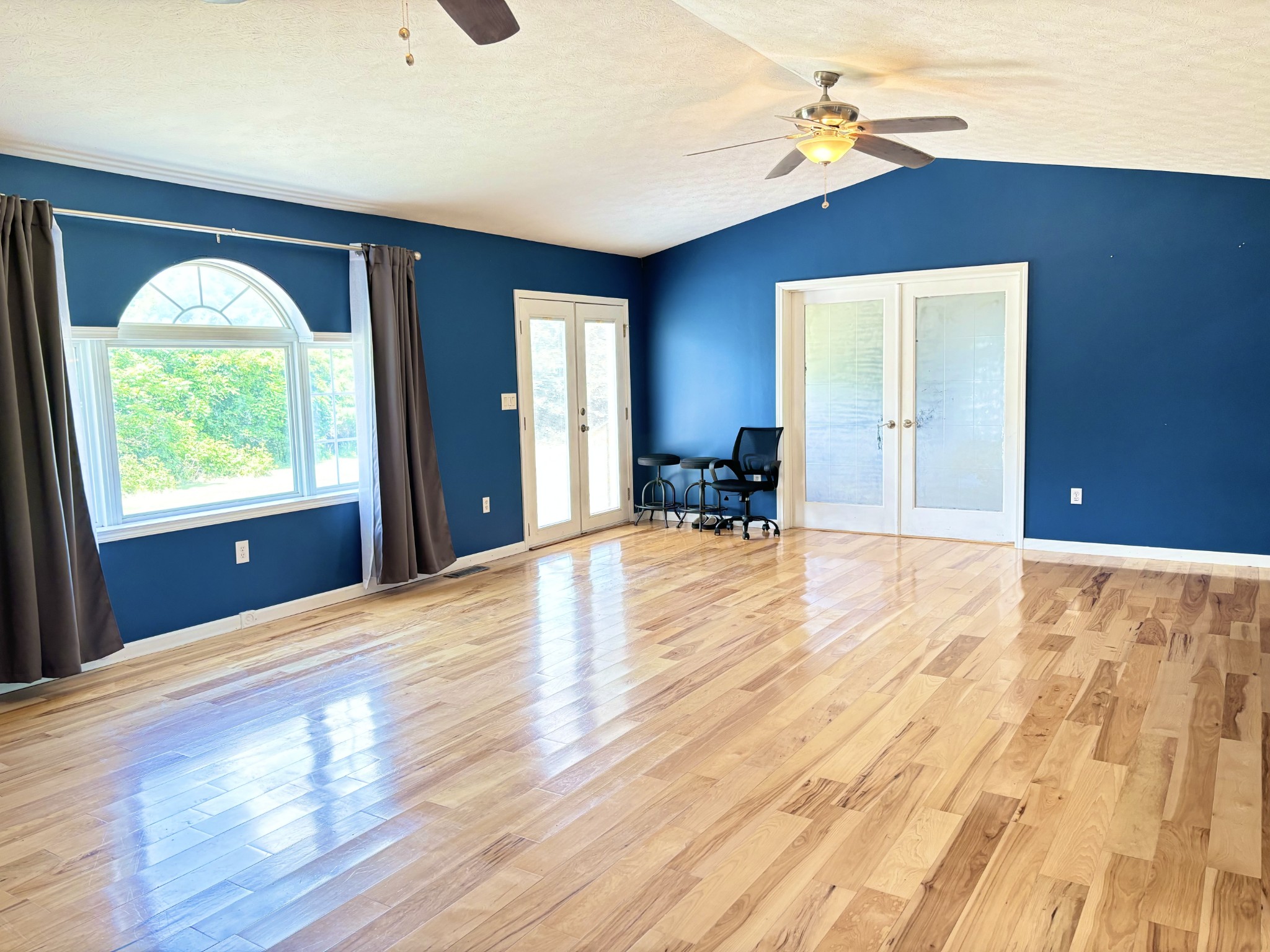 545 Adams Store Poole Mill Road Crofton, KY 42217 - Photo 42 of 48 a view of an empty room with wooden floor and a window