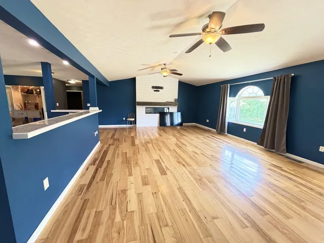 a view of a house with a backyard