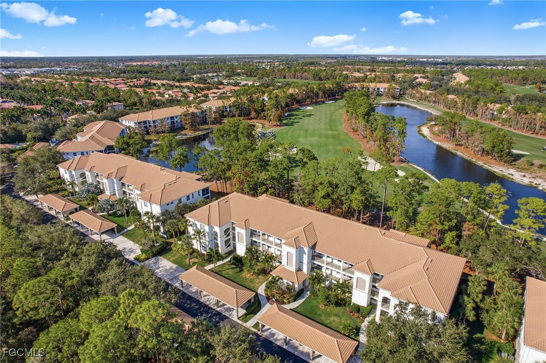 8231 Parkstone Place, Unit 105 Naples, FL 34120 - Photo 33 of 43 an aerial view of residential houses with outdoor space