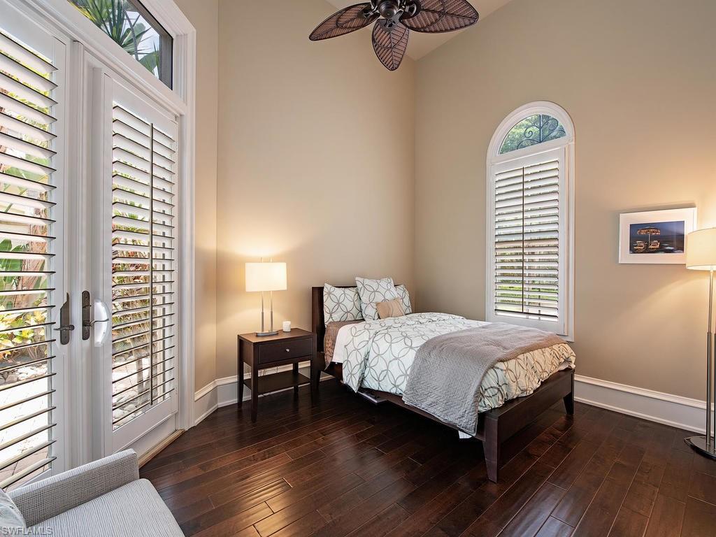 18081 Lagos Way Naples, FL 34110 - Photo 12 of 23 a bedroom with a bed and a window