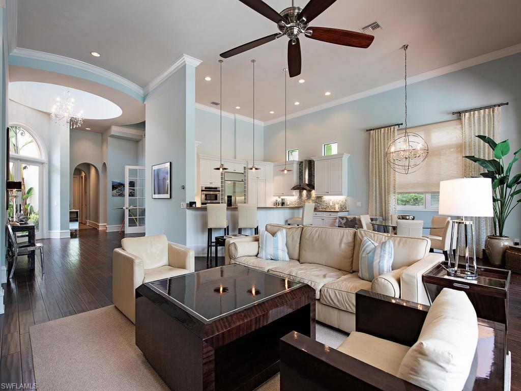 18081 Lagos Way Naples, FL 34110 - Photo 3 of 23 a living room with furniture and a large window