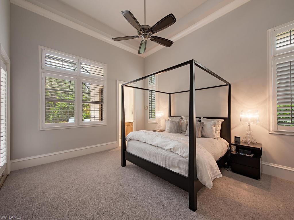 18081 Lagos Way Naples, FL 34110 - Photo 10 of 23 a bedroom with a bed and window