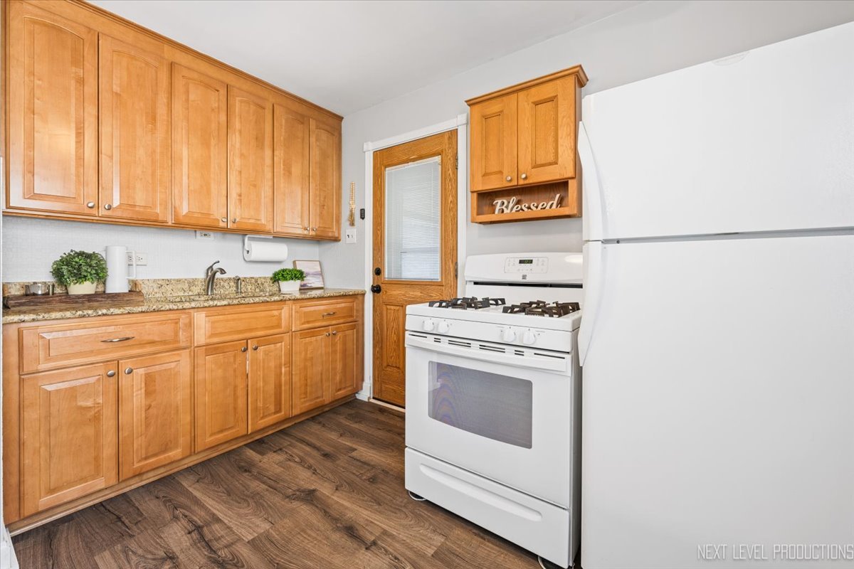 2440 South 20th Avenue Broadview, IL 60155 - Photo 12 of 24 a kitchen with sink cabinets and appliances