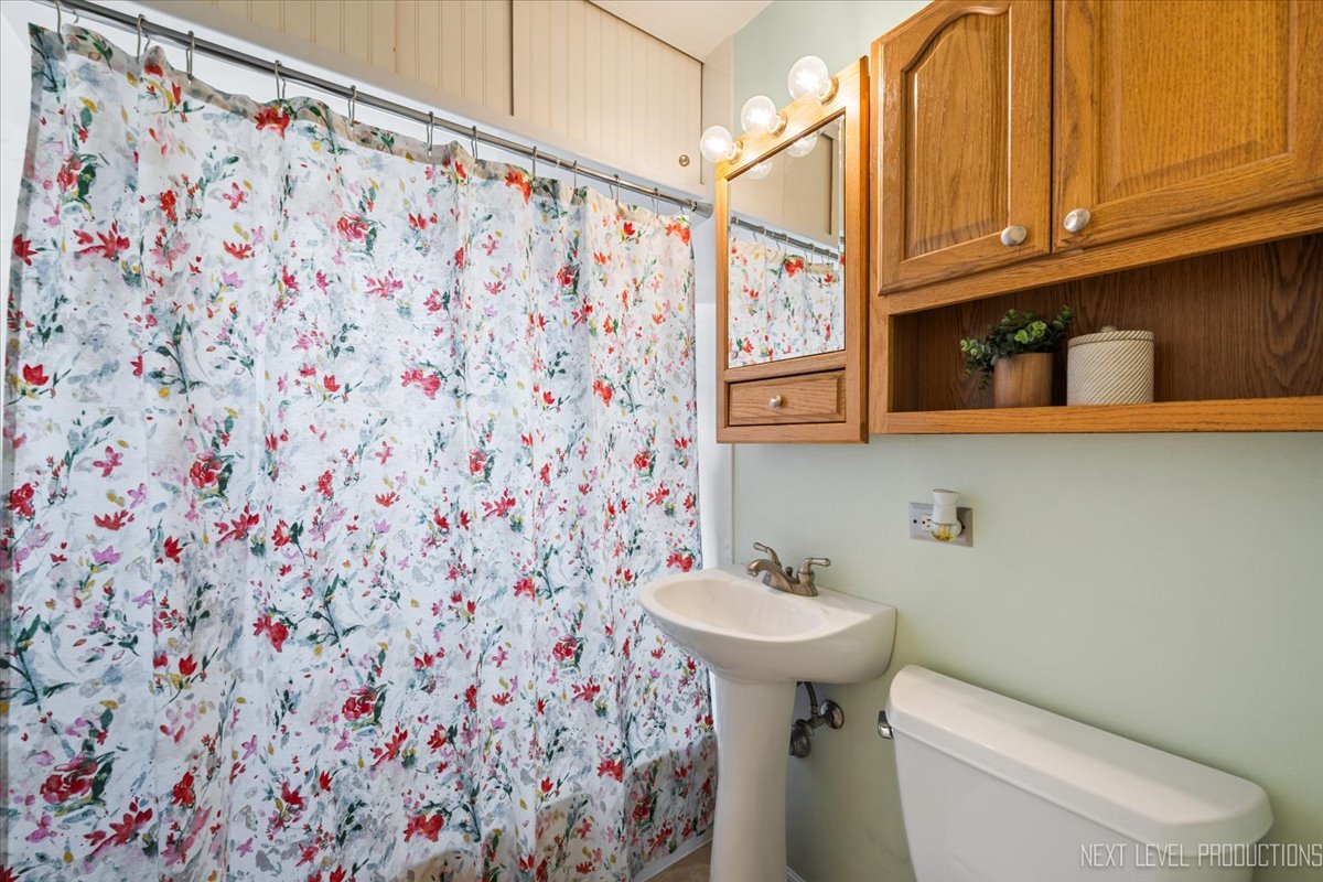 2440 South 20th Avenue Broadview, IL 60155 - Photo 13 of 24 a bathroom with a sink toilet and shower