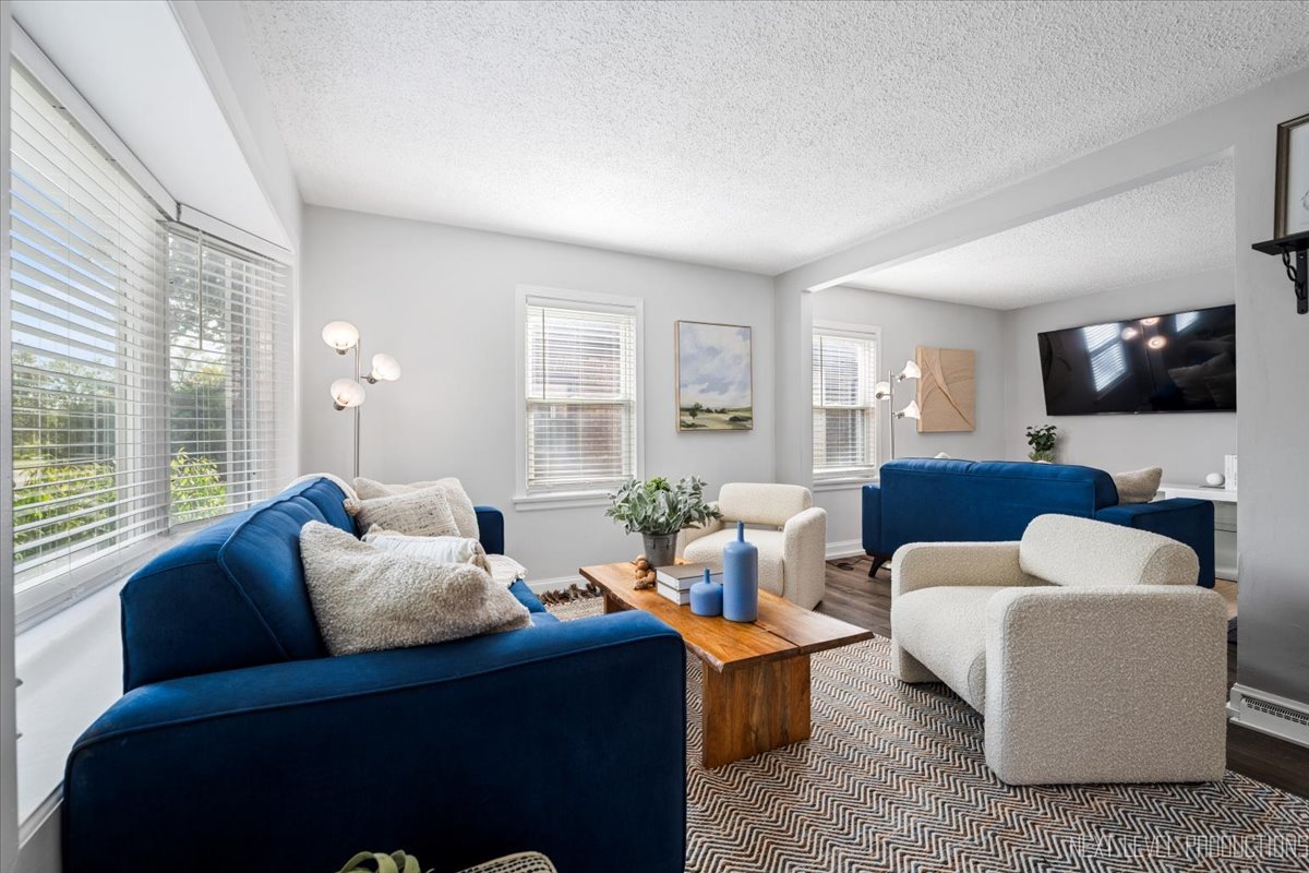 2440 South 20th Avenue Broadview, IL 60155 - Photo 2 of 24 a living room with furniture and a flat screen tv