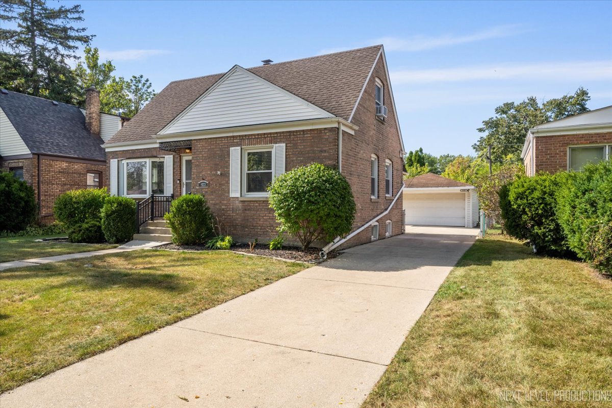 2440 South 20th Avenue Broadview, IL 60155 - Photo 23 of 24 a front view of a house with garden