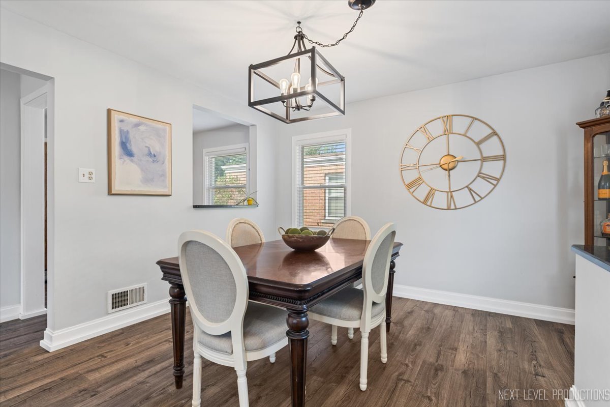 2440 South 20th Avenue Broadview, IL 60155 - Photo 9 of 24 a view of a dining room with furniture window and wooden floor