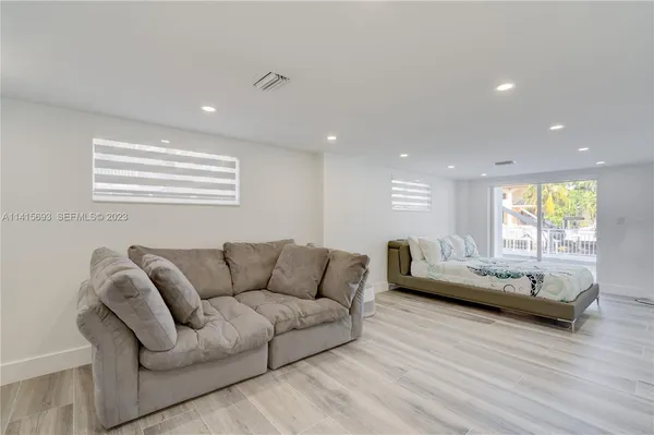 a front view of a house with a yard and a garage