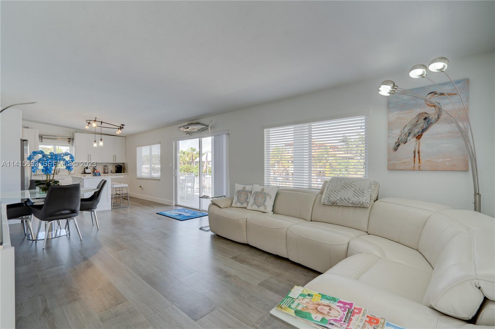 48 Andros Road Key Largo, FL 33037 - Photo 21 of 60 a living room with furniture and a large window