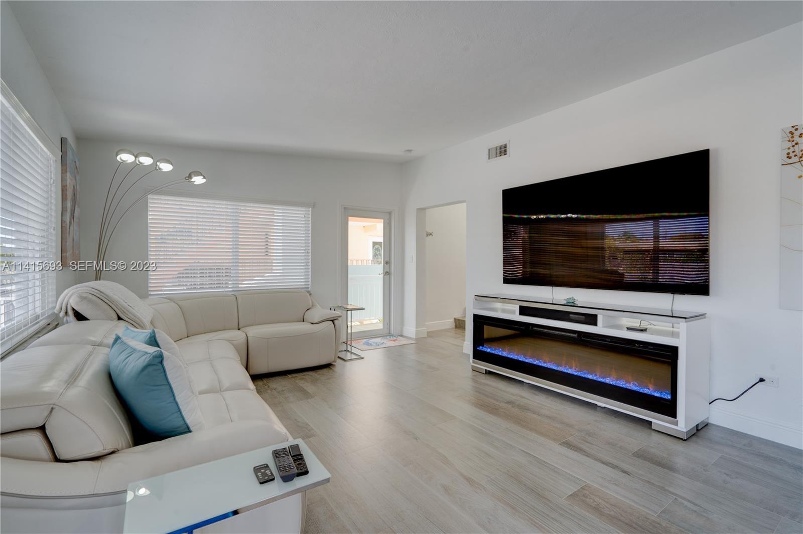 48 Andros Road Key Largo, FL 33037 - Photo 23 of 60 a living room with furniture and a flat screen tv