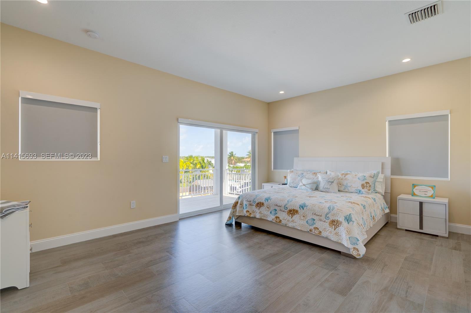 48 Andros Road Key Largo, FL 33037 - Photo 38 of 60 a bedroom with a bed and a large window