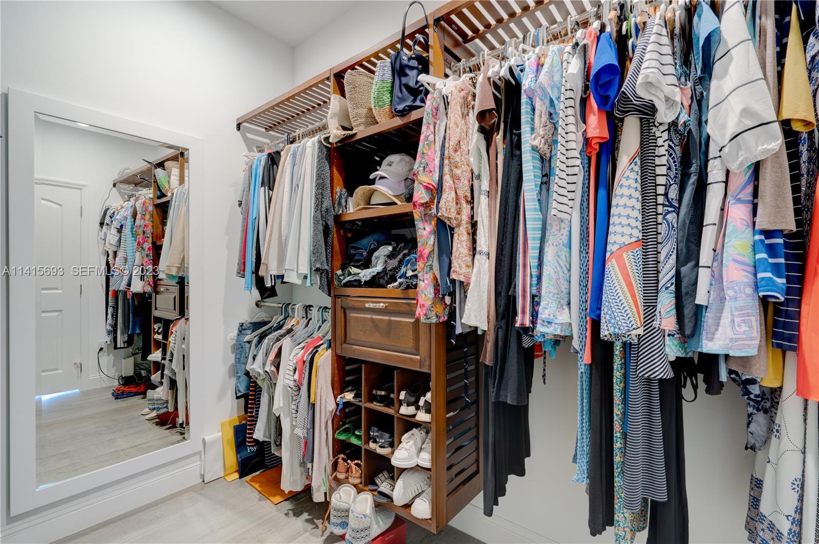 48 Andros Road Key Largo, FL 33037 - Photo 40 of 60 a view of walk in closet with clothes and shoes