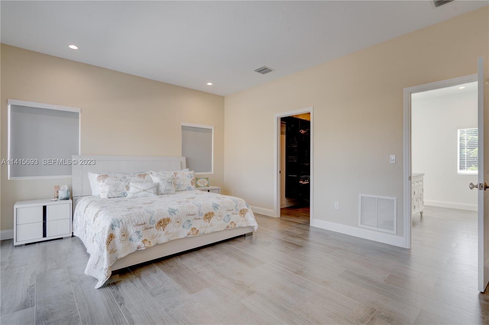 48 Andros Road Key Largo, FL 33037 - Photo 45 of 60 a bedroom with a bed and a table