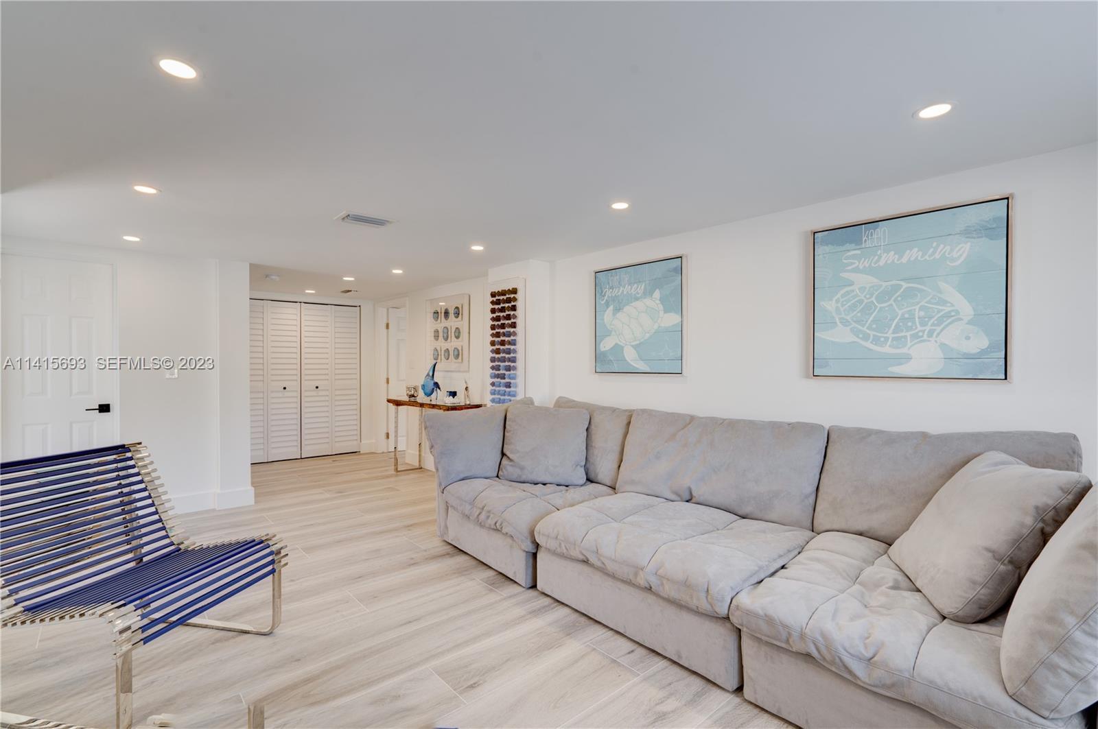 48 Andros Road Key Largo, FL 33037 - Photo 55 of 60 a living room with furniture and a couch