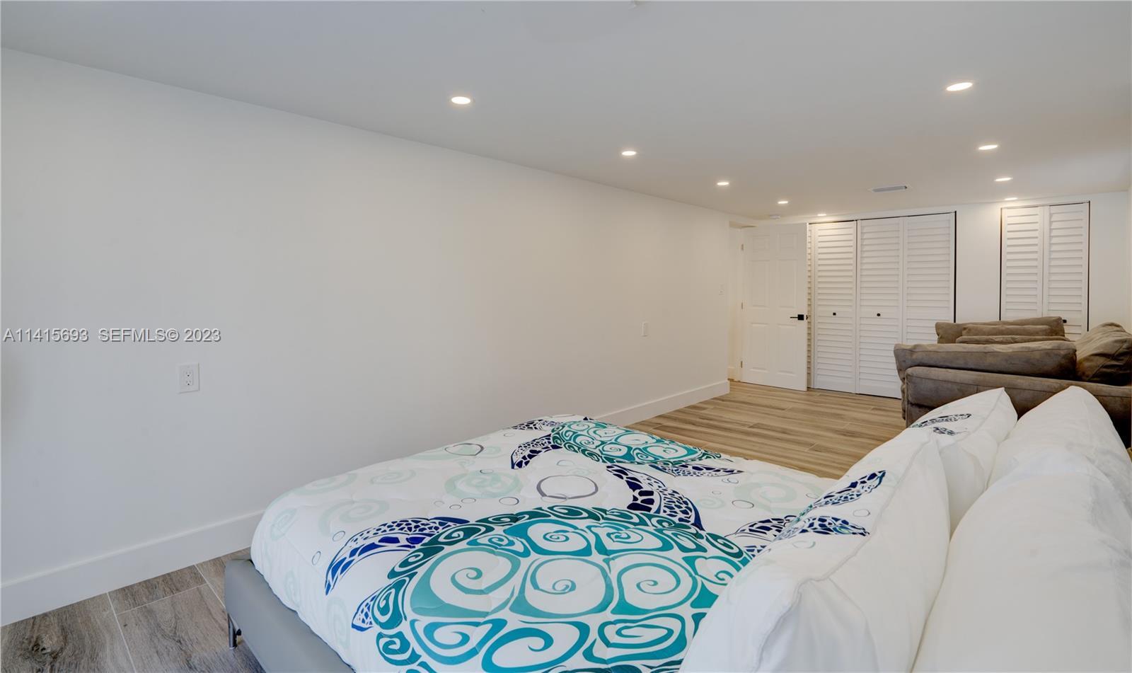 48 Andros Road Key Largo, FL 33037 - Photo 57 of 60 a bedroom with a bed and a window