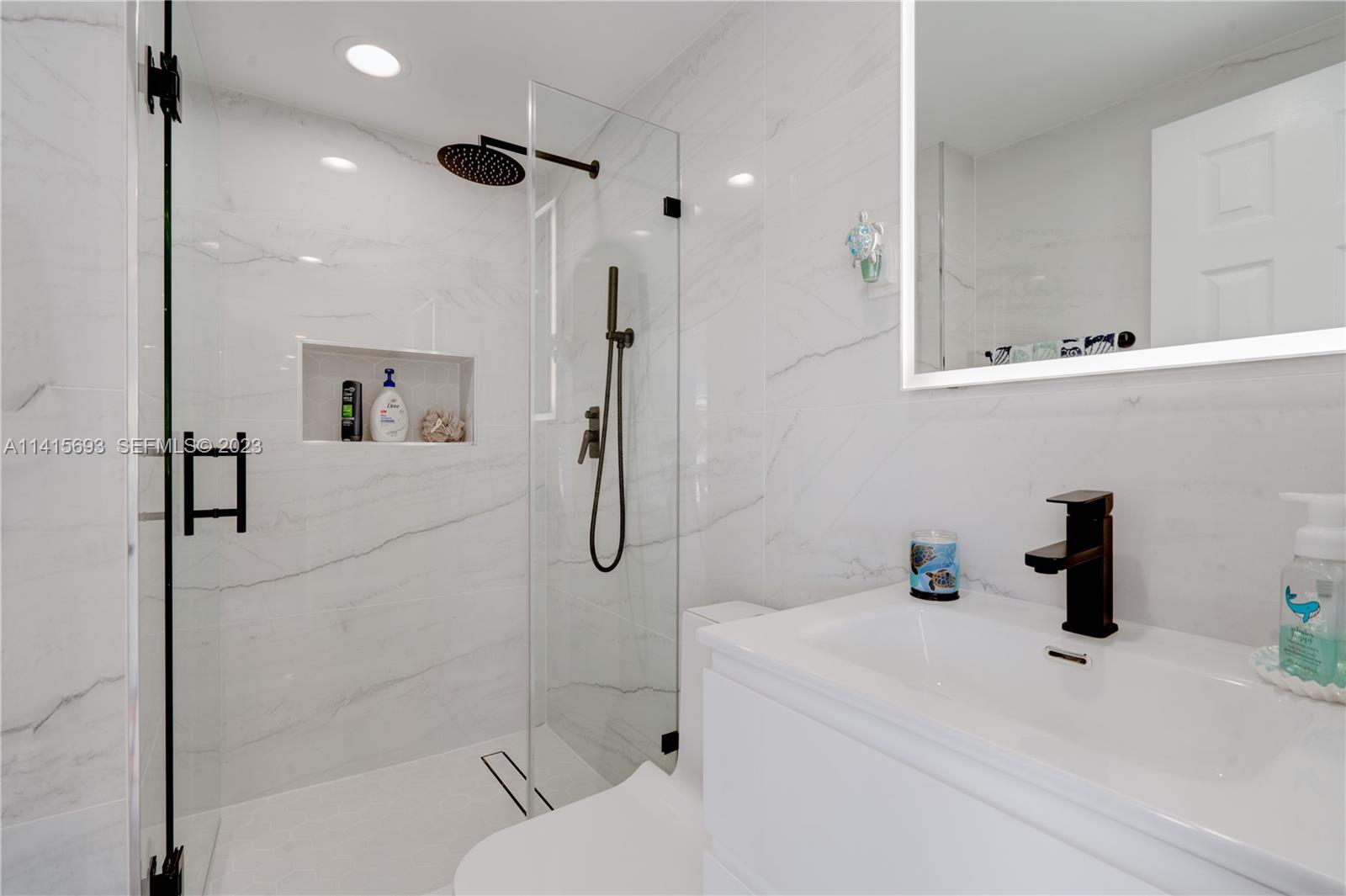 48 Andros Road Key Largo, FL 33037 - Photo 60 of 60 a bathroom with a sink a toilet and shower