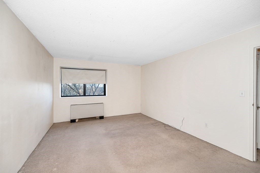 3 Summit Drive, Unit 16 Reading, MA 01867 - Photo 14 of 21 a view of an empty room with a window