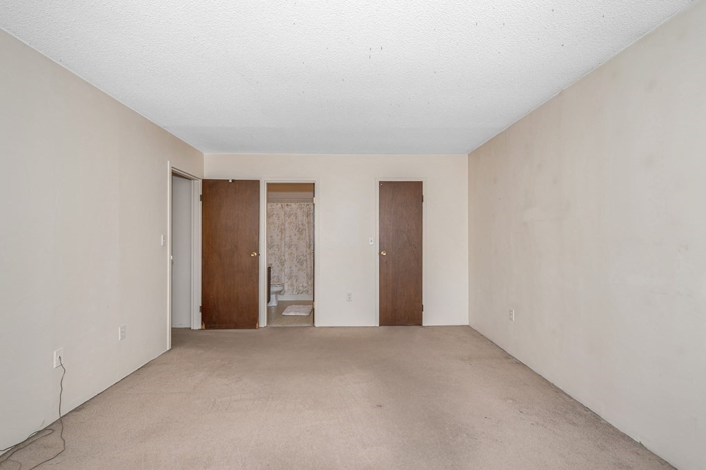 3 Summit Drive, Unit 16 Reading, MA 01867 - Photo 15 of 21 a view of an empty room and closet area