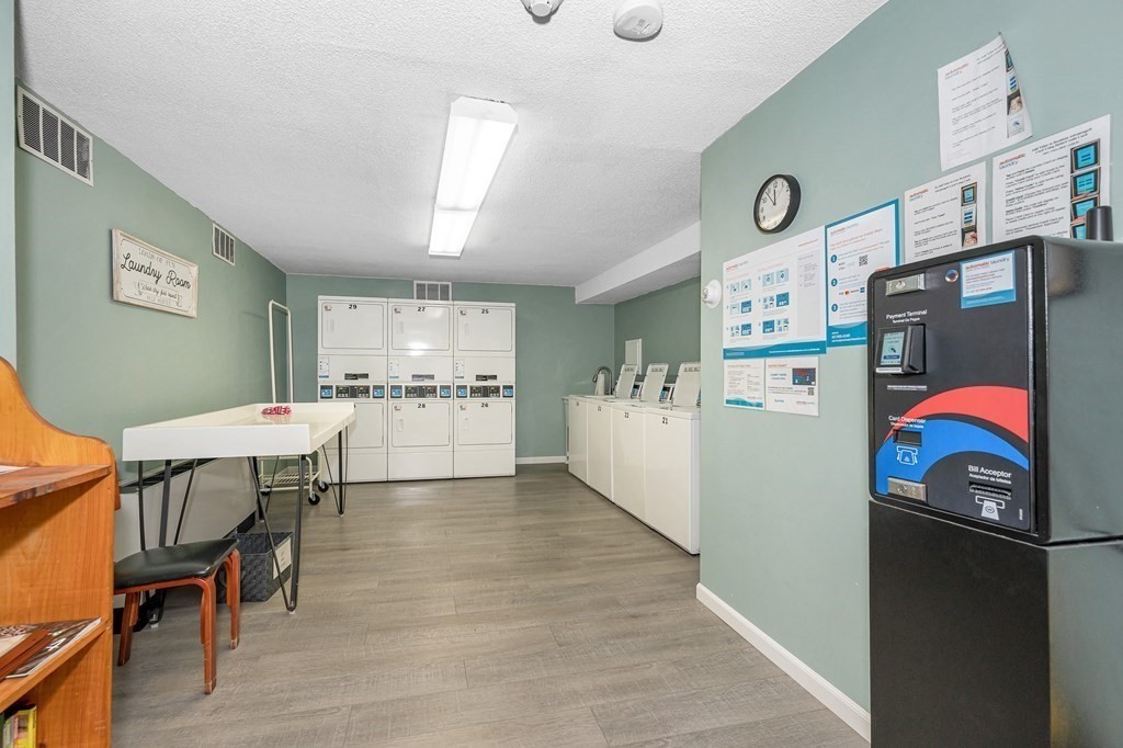 3 Summit Drive, Unit 16 Reading, MA 01867 - Photo 20 of 21 a view of a kitchen and utility room