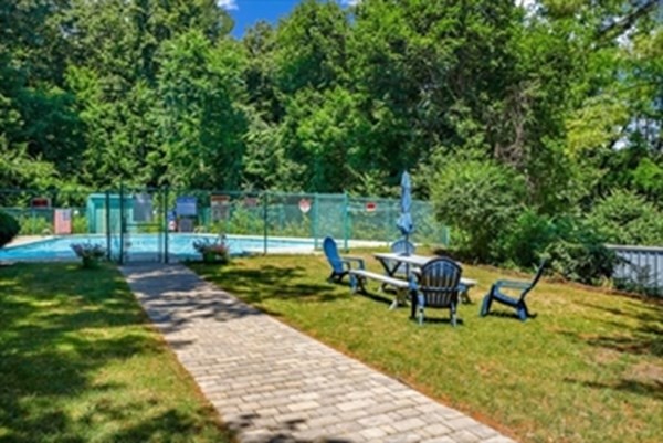 3 Summit Drive, Unit 16 Reading, MA 01867 - Photo 21 of 21 a view of a patio with table and chairs potted plants and large tree