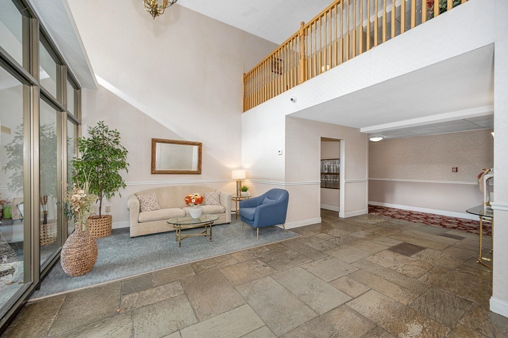 3 Summit Drive, Unit 16 Reading, MA 01867 - Photo 4 of 21 a living room with furniture and a potted plant