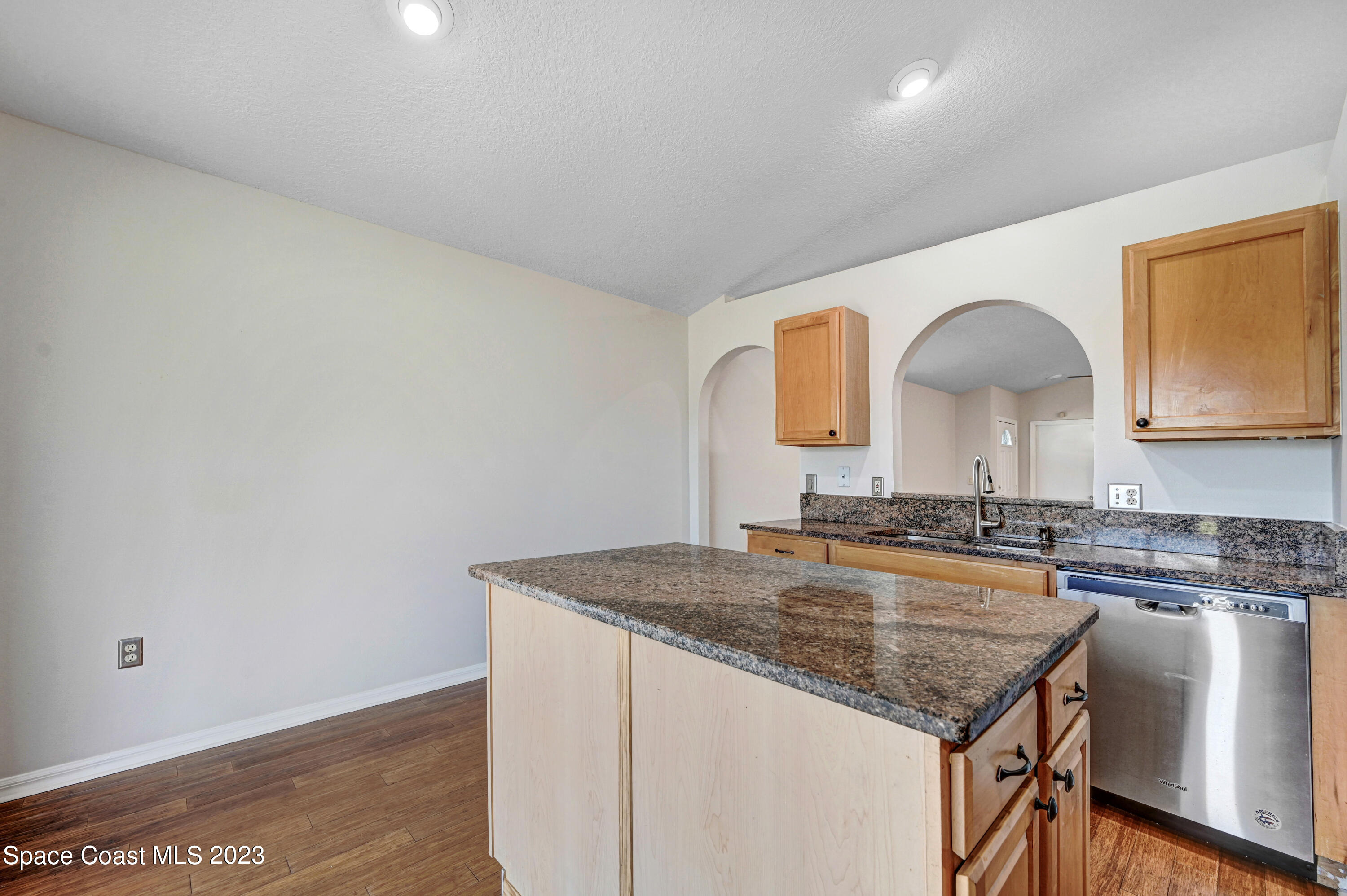 2070 Redwood Circle Palm Bay, FL 32905 - Photo 11 of 33 a kitchen with granite countertop a sink and cabinets