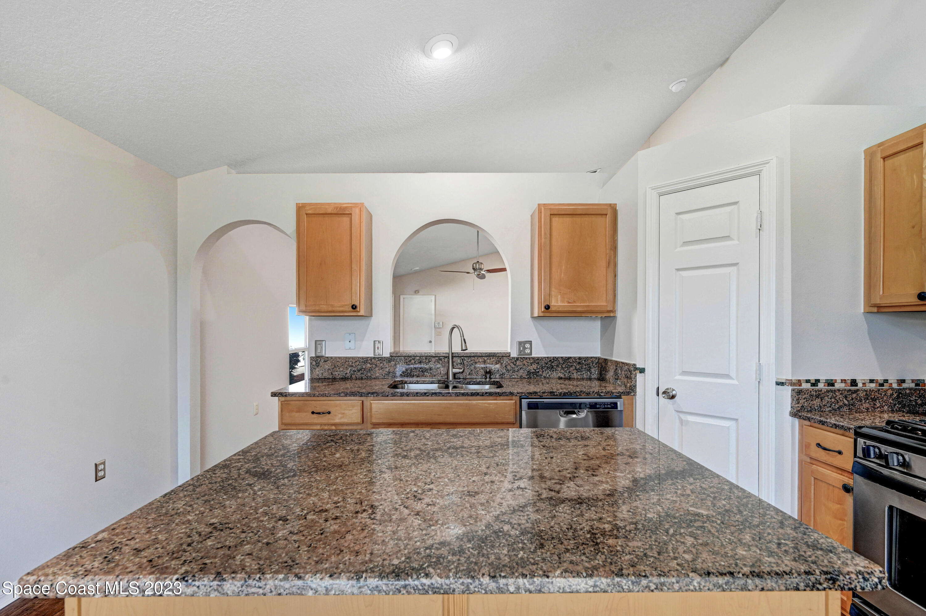 2070 Redwood Circle Palm Bay, FL 32905 - Photo 12 of 33 a view of living room and kitchen